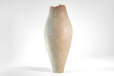 This unique tall ceramic vessel is handmade. Image 3
