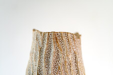 This unique tall ceramic vessel is handmade. Image 12