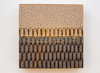 This contemporary ceramic wall tile is handmade.