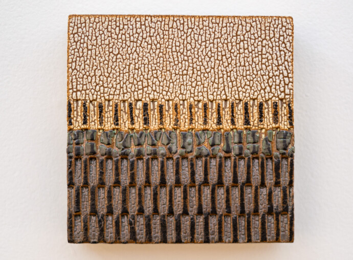 This contemporary ceramic wall tile is handmade.