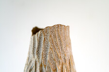 This unique tall ceramic vessel is handmade. Image 11