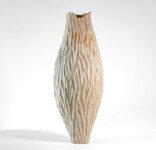 This unique tall ceramic vessel is handmade. Image 2