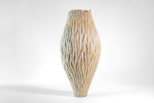 This unique tall ceramic vessel is handmade. Image 2
