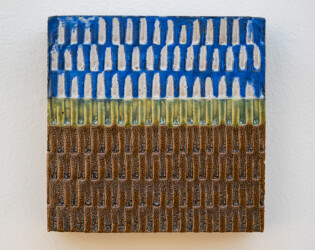 This contemporary ceramic wall tile is handmade.