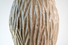 This unique tall ceramic vessel is handmade. Image 9