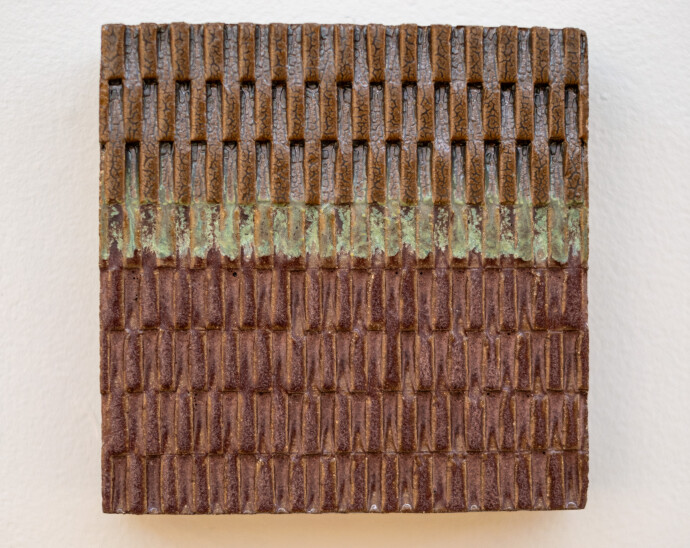 This contemporary ceramic wall tile is handmade.