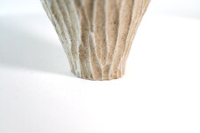 This unique tall ceramic vessel is handmade. Image 5