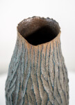 This contemporary tall ceramic vessel is handmade. Image 8