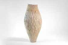 This unique tall ceramic vessel is handmade. Image 4