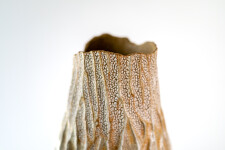 This unique tall ceramic vessel is handmade. Image 10