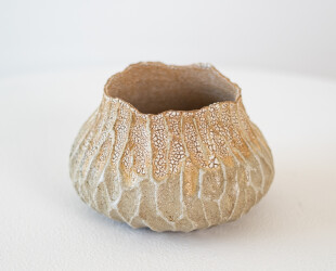 This contemporary ceramic vessel is handmade.