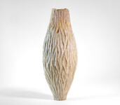 This unique tall ceramic vessel is handmade. Image 4