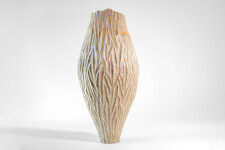 This unique tall ceramic vessel is handmade. Image 3