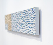 The contemporary horizontal panels of this wall composition are handmade in ceramic. Image 3