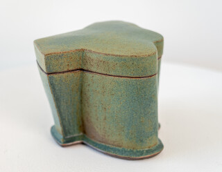 This contemporary blue-green ceramic box is made by Bruce Cochrane.
