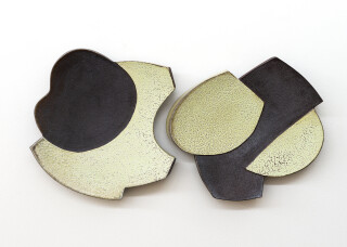 This contemporary pair of ceramic wall plates is by Bruce Cochrane.