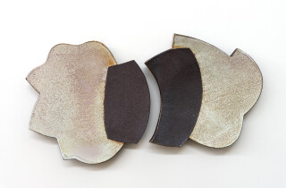 This contemporary pair of ceramic wall plates is by Bruce Cochrane.
