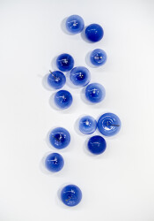 This contemporary lapis-colored glass wall sculpture was created by a Canadian artist.