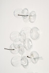 This contemporary wall sculpture features bubbles of clear glass. Image 8