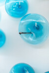 This contemporary wall sculpture features bubbles of blue glass. Image 7