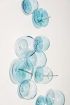This contemporary wall sculpture features bubbles of blue glass. Image 4