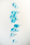 This contemporary wall sculpture features bubbles of blue glass. Image 2