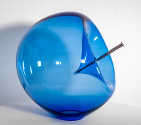 The contemporary blue glass tabletop sculpture is by Cheryl Wilson Smith.