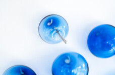 This contemporary glass wall sculpture features cerulean colored bubbles. Image 10