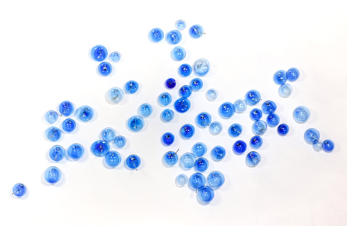 This contemporary cerulean blue-coloured glass wall sculpture was created by Cheryl Wilson Smith.