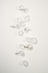 This contemporary wall sculpture features bubbles of clear glass. Image 2