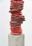 Paper-thin layers of deep red glass frit (special ground glass) are carefully stacked in these striking columns created by Canadian artist C… Image 3