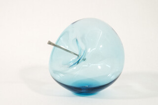 The contemporary blue glass tabletop sculpture is by Cheryl Wilson Smith.