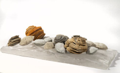 The beauty of a clear, cool stream—the water rippling beneath a bed of rocks is captured in this dynamic tabletop sculpture by Cheryl Wilson… Image 8