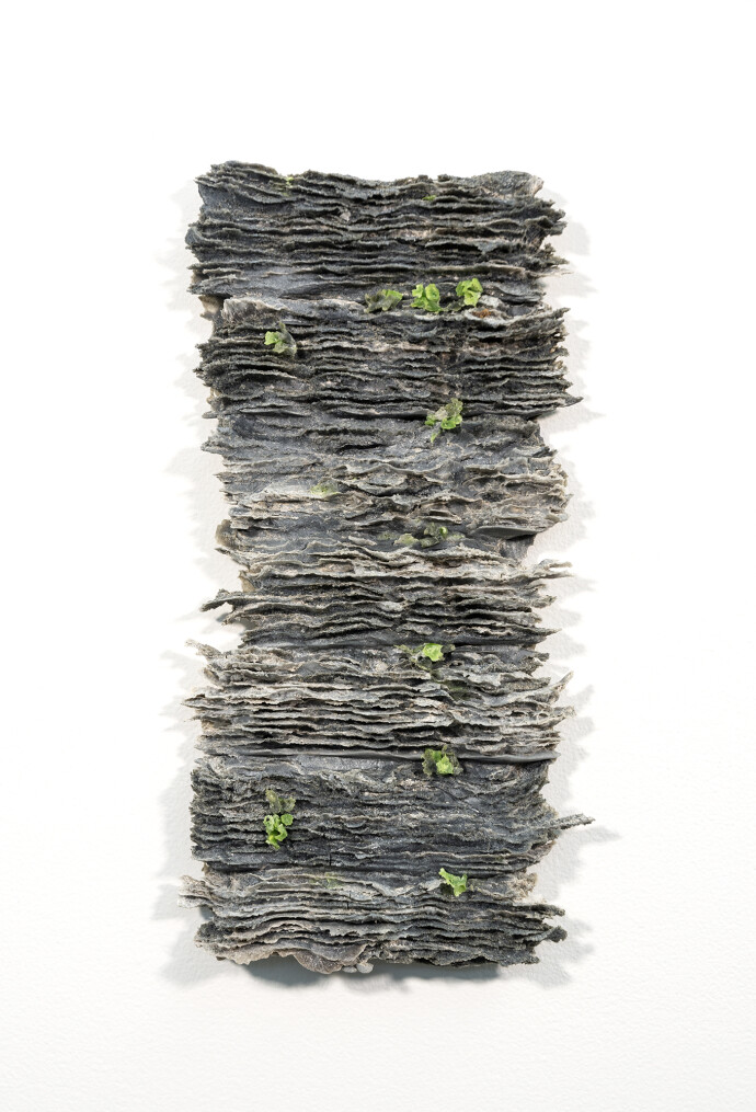 This contemporary wall sculpture created by Cheryl Wilson Smith features mirrored bubbles.