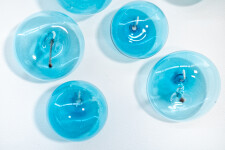 This contemporary wall sculpture features bubbles of blue glass. Image 9