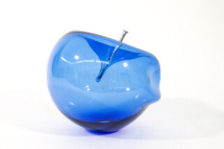 The contemporary blue glass tabletop sculpture is by Cheryl Wilson Smith.
