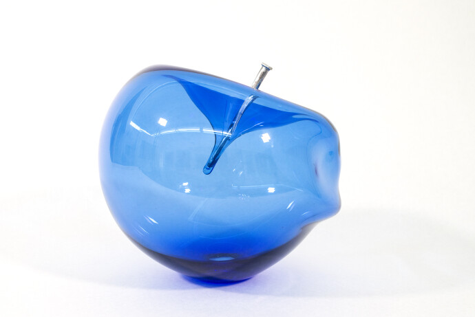The contemporary blue glass tabletop sculpture is by Cheryl Wilson Smith.
