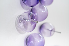 This contemporary, purple-colored, glass wall sculpture was created by Cheryl Wilson Smith. Image 11