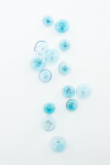 This contemporary wall sculpture features bubbles of blue glass. Image 10