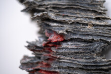 This contemporary glass wall sculpture resembles rock. Image 10