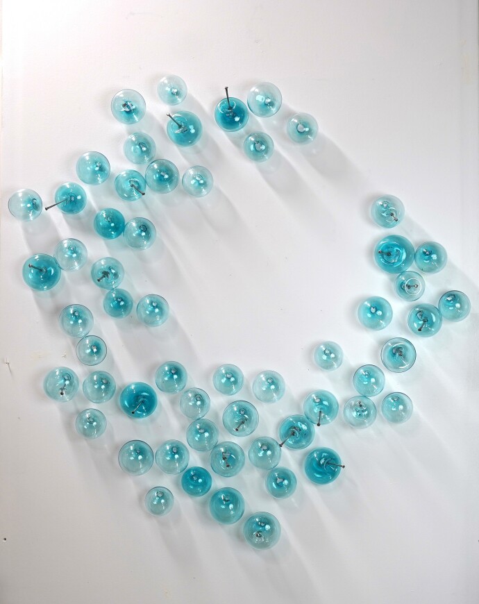 This contemporary glass wall sculpture was created by Cheryl Wilson Smith.