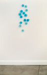 This contemporary wall sculpture features bubbles of blue glass. Image 4
