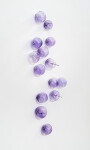 This contemporary, purple-colored, glass wall sculpture was created by Cheryl Wilson Smith. Image 2
