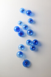 This contemporary cerulean-colored glass wall sculpture was created by a Canadian artist.