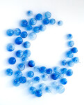 This contemporary glass wall sculpture features cerulean colored bubbles. Image 2