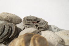 The beauty of a clear, cool stream—the water rippling beneath a bed of rocks is captured in this dynamic tabletop sculpture by Cheryl Wilson… Image 5