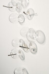 This contemporary wall sculpture features bubbles of clear glass. Image 6