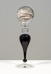 This contemporary table top, clear and black glass piece, is by Cheryl Wilson Smith.