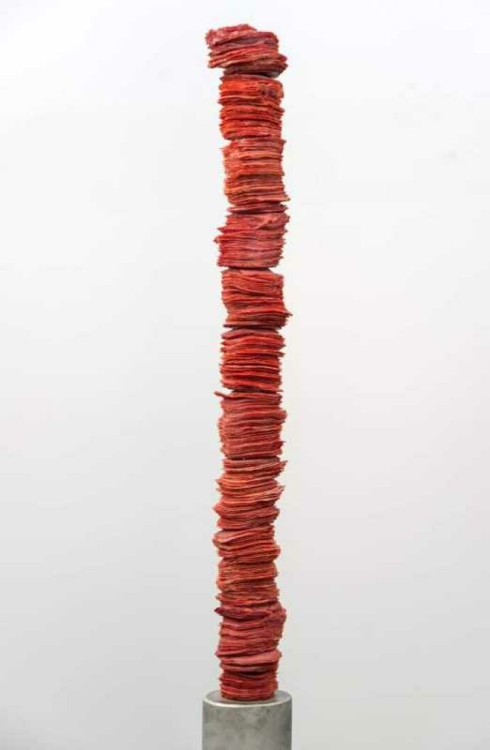 Paper-thin layers of deep red glass frit (special ground glass) are carefully stacked in these striking columns created by Canadian artist C…