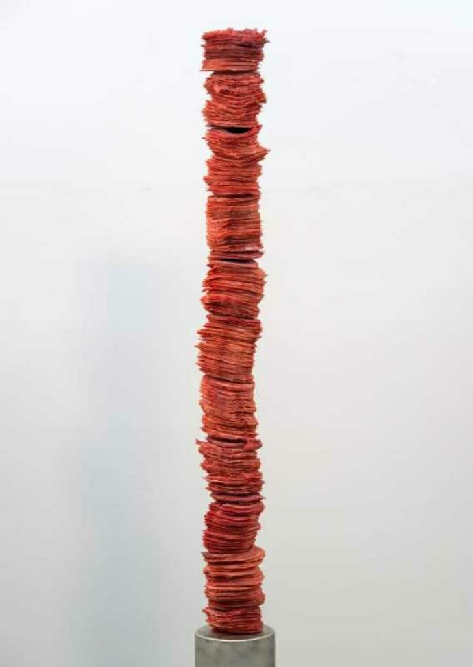 Paper-thin layers of deep red glass frit (special ground glass) are carefully stacked in these striking columns created by Canadian artist C…